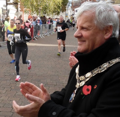 Picture: Brigg Town Mayor Coun Donald Campbell applauding competitors in the Brigg Poppy 10k 2018 event - held in October - as they approach the finishing line - see Nigel Fisher's Brigg Blog