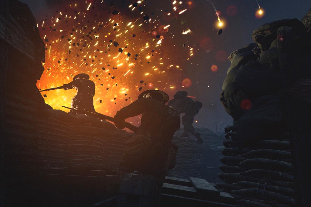 An explosion, as three soldiers climb out of a trench.