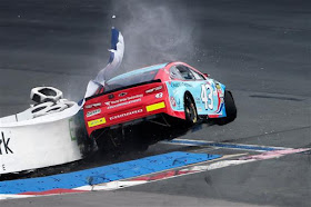 Bubba Wallace, driver of the #43 World Wide Technology Chevrolet,  crashes into a tire barrier during practice for the NASCAR Cup Series 