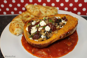 stuffed butternut squash on a plate with garlic bread