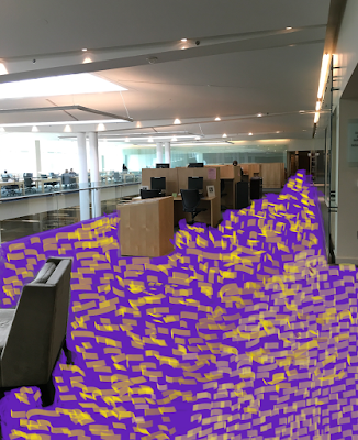 photo of library main floor with carpet altered to obnoxious purple & gold print