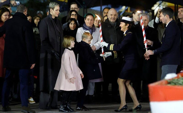 Princess Gabriella wore a pink ribbed wool coat by Emporio Armani. Princess Charlene wore a cashmere coat by Loro Piana