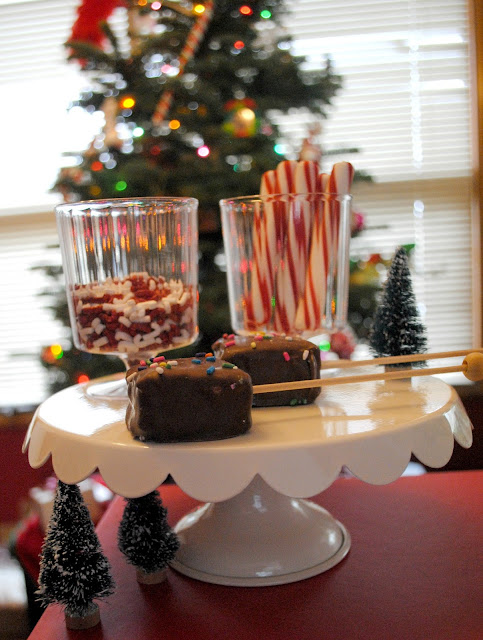 Marshmallow pops are a must for a hot cocoa bar. More inspiration can be found at FizzyParty.com 