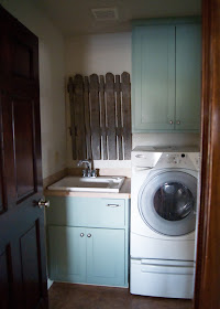 Laundry Room Makeover - After - Green blue cabinets and old fence decor