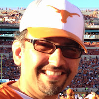 Sanjay Dalal wearing Glasses and Longhorn Hat - Headshot November 2, 2013