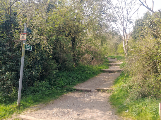 The footpath opposite The Alford Arms heading SW and uphill (point 1)