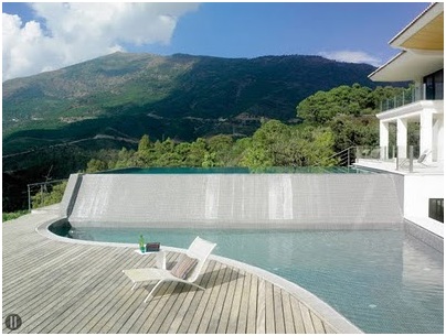 Wooden decks on a poolside. Swimming pool with a beautiful view to countryside