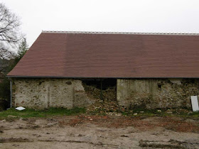 New tile roof on an old limestone barn.  Indre et Loire, France. Photographed by Susan Walter. Tour the Loire Valley with a classic car and a private guide.