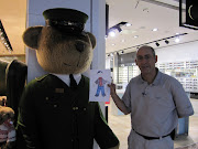 . picture in front of a Harrod's store character at the London Airport. (img )