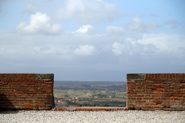 Views through brick wall of Tuscan Rolling Countryside in Italy