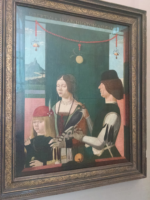 Renaissance portrait of a child, woman, and man