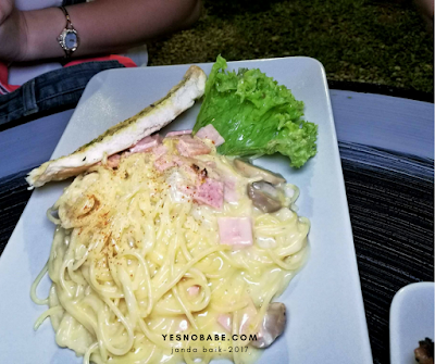 The spaghetti in carbonara sauce with a piece of garlic bread as side dishes of Nero Bianco Deli, Janda Baik, Pahang Malaysia