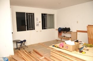 Notice the waist-level plank mounted on the wall - it will be used as guide for the double wall