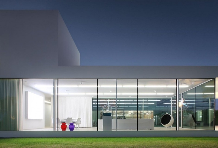 Interior of Minimalist Home by Beel & Achtergael Architects seen from the outside
