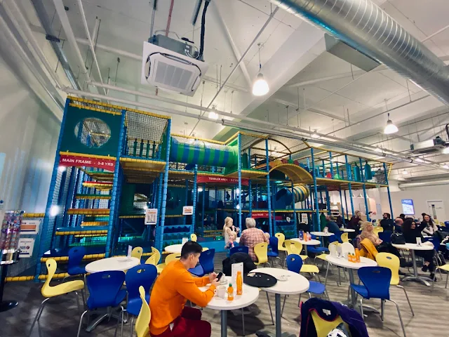 View across the seating area to the soft play frame at Rock Up Essex