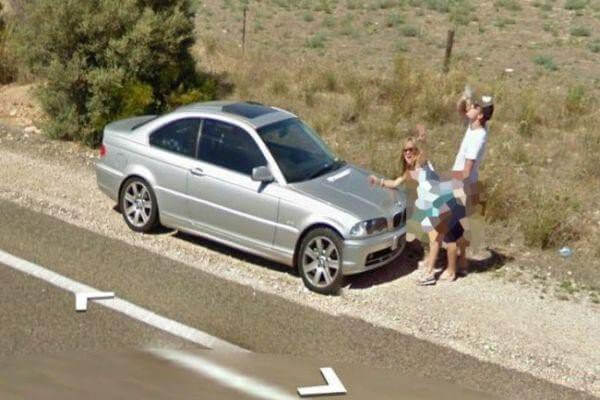 18 Hilariously Weird Moments Captured On Google Street View - Posing for photos in an inappropriate position in the middle of the street