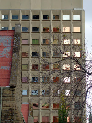 downtown building with little coloured square windows reflecting