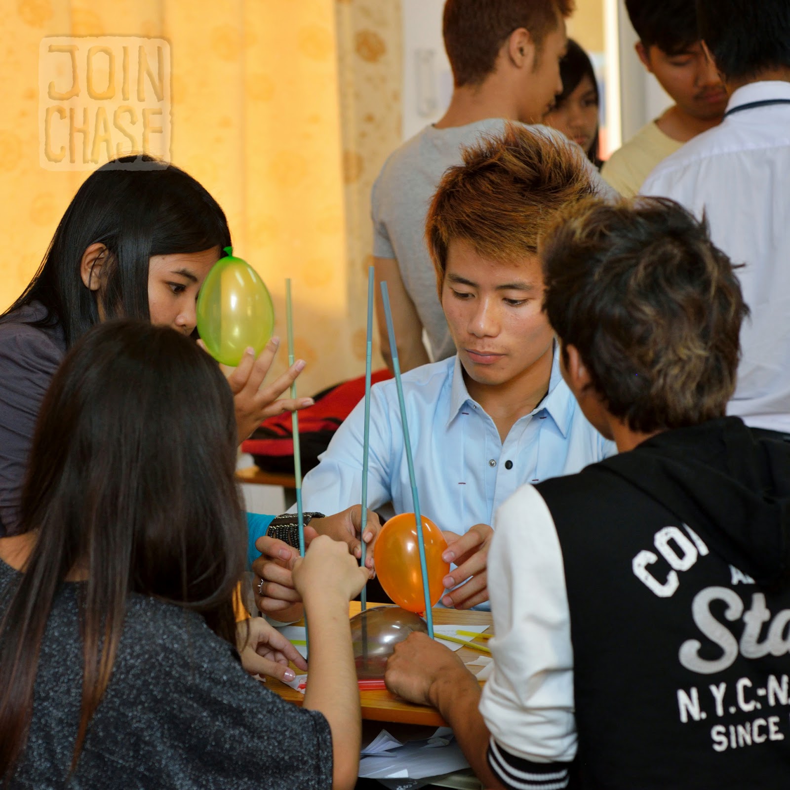 Students building balloon towers during English class in Yangon, Myanmar.