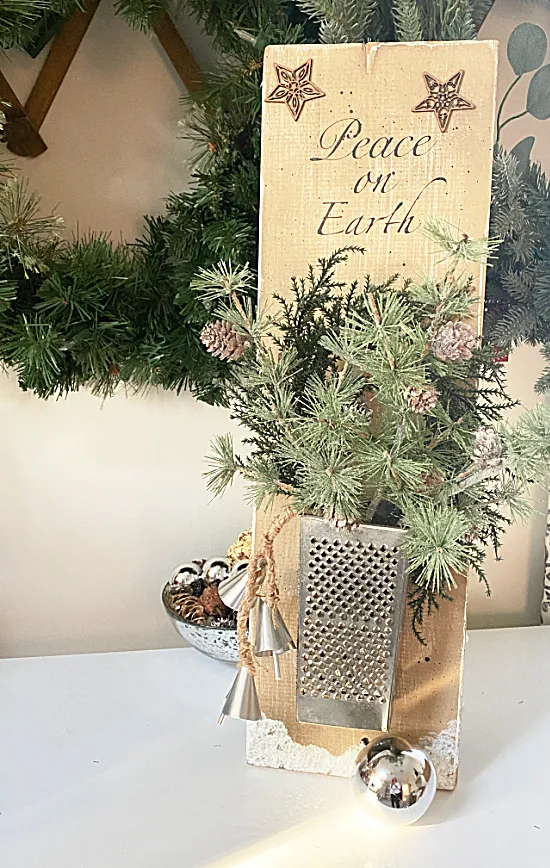 cheese grater wall vase with greens