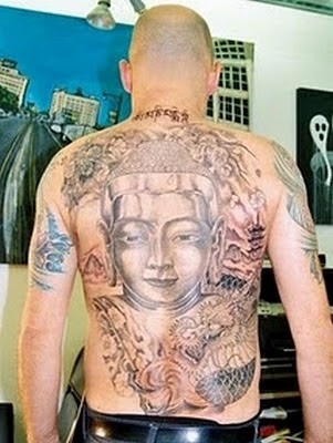 Buddhist tattoo of the Buddha sitting on a lotus flower. Big Buddha Tattoo Design