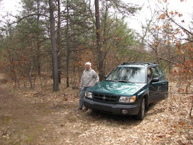 car parked in woods