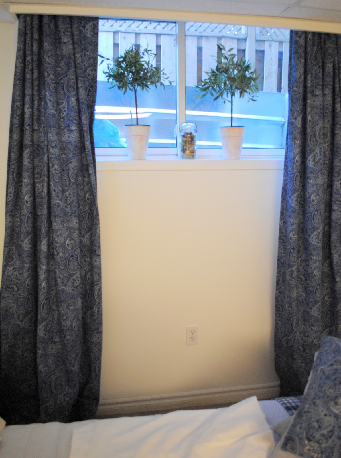 or should I use the lighter white curtains and touches of blue? title=
