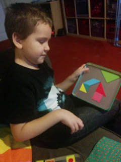 Dan Jon Jr playing tangrams