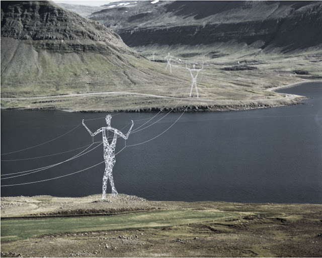 Photo of pylons holding the wires through the landscape