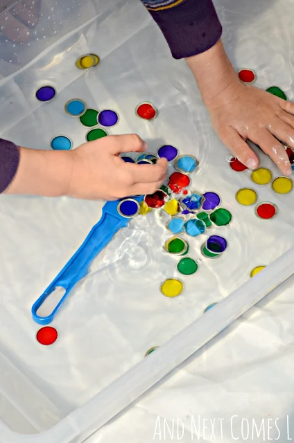 Hands on water sensory play with magnets