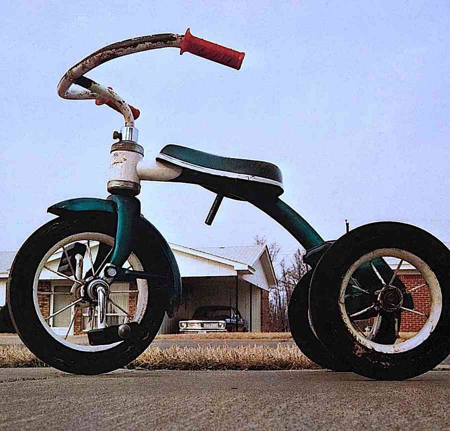 a 1960s child's tricycle color photograph