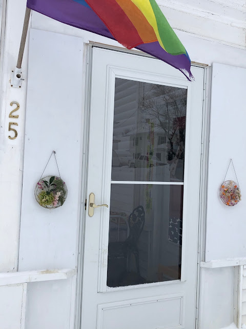 Front Door with Ice/Flower Disks and Rainbow Flag