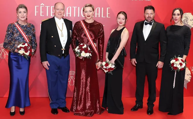 Princess Charlene wore a sequins stretch sheath long gown by Akris. Princess Caroline wore a blue skirt and sequin top by Chanel