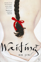 The cover of the Vintage edition of Waiting by Ha Jin showing a woman's back with long dark plait tied with a red bow