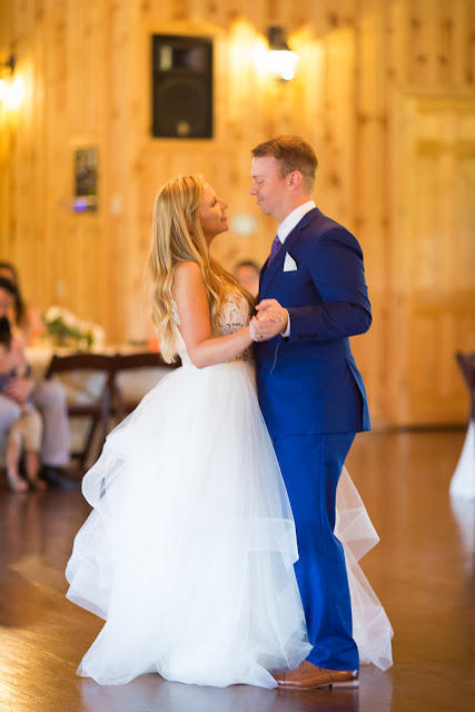 Something old, something new, something borrowed, something blue.  Sarah looked like she could have stepped right out of a Vogue Bridal magazine as she floated down the stairs in her beautiful wedding gown: a fitted, sleeveless, delicate lace bodice above a floor-length skirt, comprised of yards and yards of whimsical, white organza.  Tanner looked dapper in his royal blue suit, paisley tie, white rose boutonniere, and fancy, wood-grained leather shoes.  The bridesmaids and maid-of-honor wore individually designed, pale-pink, floor-length gowns and carried small bouquets similar to the bride’s pastel bouquet of beautiful, blush and ivory roses and ranunculus.      The SpringsEvent Venue in Edmond, OK, with its rustic and elegant accommodations, was the perfect setting For Sarah and Tanner’s intimate wedding and reception.  The morning began with First Looks for both the bride’s father, and then Tanner.  The clouds threatened rain throughout the morning—and almost drenched the bride and her maids during the picture-taking for the wedding party—but miraculously cleared up for the outdoor wedding nuptials.  The wedding couple were blessed to have so many people who traveled from throughout the country to celebrate their special day.   Sarah and Tanner agreed that their two favorite parts of the day were “getting to see each other during the first look, and then the actual wedding when we said our vows.”  Sarah said that during the first look, “we were able to spend those precious moments focusing on each other without all the hustle and bustle around us.”  After months of preparation and planning, she said, “the vows were also our favorite because we were finally getting married!”  Sarah’s suggestions to future brides, now that she has experienced her own wedding:  "Each and every moment is special:  getting ready, the first looks, walking down the aisle, the vows, the cake cutting, the dancing…take a moment or two to just slow down and take it all in…you’ll be glad you did!"  It was my pleasure to capture these beautiful memories for Sarah, Tanner and their families that will last forever.  For more information about my Wedding Packages, please visit my Weddings page on my website, www.michellevalantinephotography.com. 