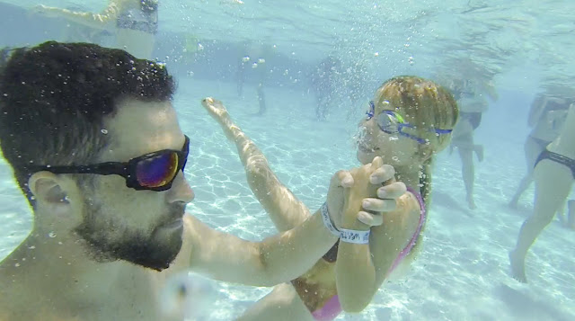 Father and daughter explore the underwater world of Adventure Landing's wave pool 