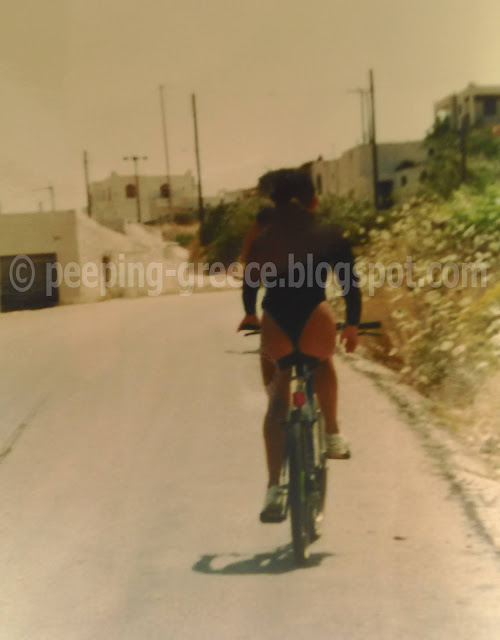 lady rides a bicycle. We enjoy the view it offers us