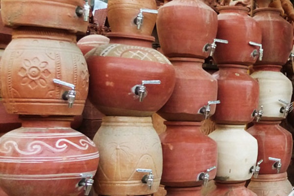 drinking water from an earthen pot