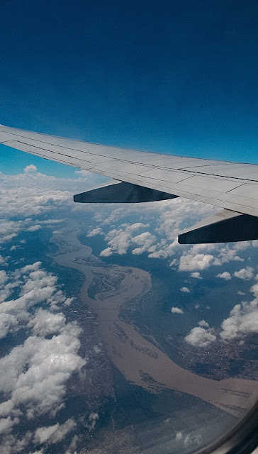 A picture of an Airplane in the blue skies