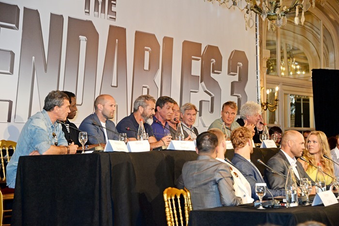 CANNES, FRANCE - MAY 18:  (Back L-R) Antonio Banderas, Wesley Snipes, Jason Statham, Mel Gibson, Sylvester Stallone, Arnold Schwarzenegger, Harrison Ford, Dolph Lundgren and (Front L-R) Victor Ortiz, Glen Powell, Kellan Lutz, Randy Couture and Ronda Rousey speak at a photocall for "The Expendables 3" at the Carlton Hotel on May 18, 2014 in Cannes, France.  (Photo by David M. Benett/Getty Images for Millennium Films)
