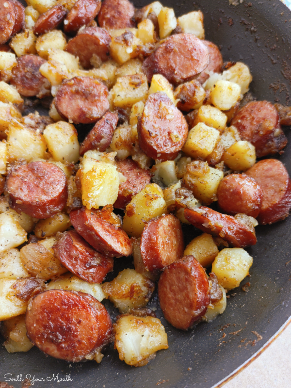Southern Fried Potatoes & Sausage! A simple budget-friendly recipe for a one-pan skillet meal with smoked sausage, onions and southern-style fried potatoes.
