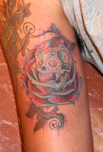 skull tattoo ideas. rose tattoos designs.