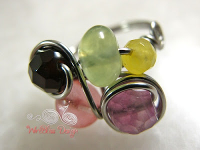 Wire wrapped fruity ring with various gemstones