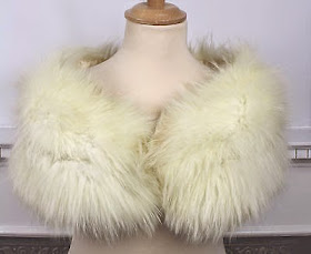 Original 1960s white fur shrug for a vintage wedding dress A fur shrug can keep you cosy through a chilly spring wedding day