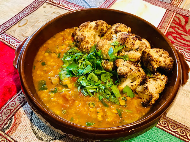 Tadka Dal - yellow lentils and tomatoes with Indian spices and chaat masala cauliflower