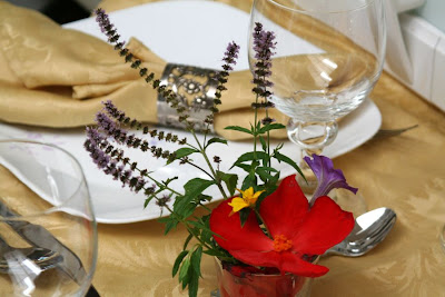 Fancy dinner at our house (no occasion :) ): golden table cloth and matching napkins set, flowers, wine goblets, silverware and good disposition :: All Pretty Things