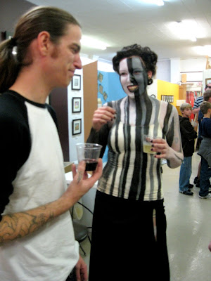 Oy of Stay True Tattoo chatting with one of the models.