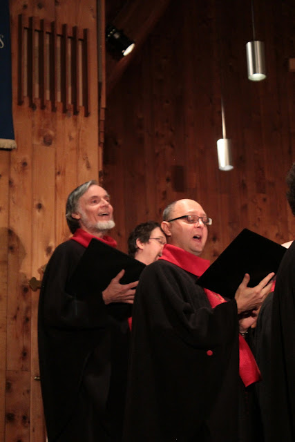 David, holding his choir book mainly for show, sings most pieces by heart.