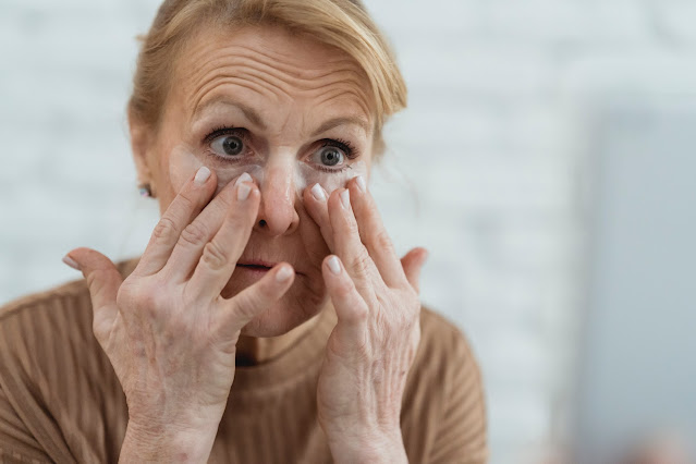 Woman checking her eye wrinkle
