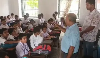 students and teacher in classroom