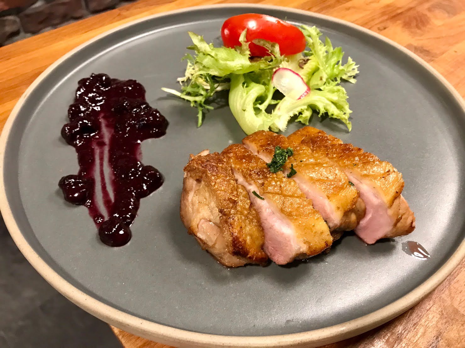 Crispy dry-aged duck breask with berry sauce